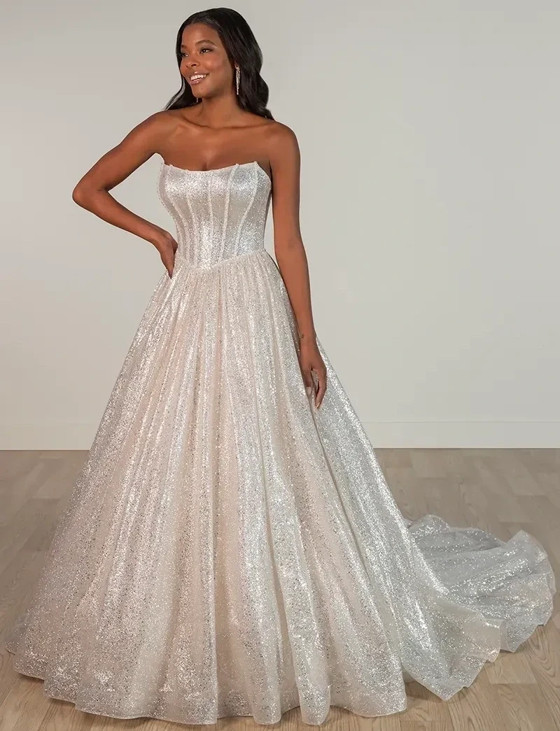 Model wearing a white gown by Stella York